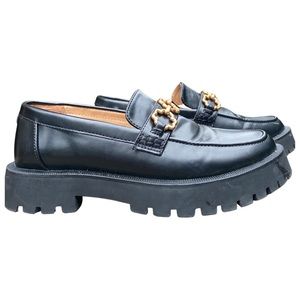 Sam and Libby black and gold loafers.